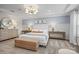 Bright main bedroom featuring tray ceiling, stylish lighting, and neutral wall paint at 15019 Meadows Hunt Ln # 163, Huntersville, NC 28078