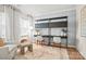 Bright home office with stylish shelving, desks, a patterned rug, and a comfortable chair at 15019 Meadows Hunt Ln # 163, Huntersville, NC 28078