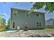 Exterior view of a home with a patio, seating, grill, and grass yard at 15035 Ockeechobee Ct, Mint Hill, NC 28227