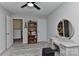 This bedroom features carpeted floors, a vanity with round mirror, a bookcase, and white trim at 15035 Ockeechobee Ct, Mint Hill, NC 28227