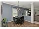 Formal dining room featuring a pendant light fixture, dark furniture, and modern decor at 15035 Ockeechobee Ct, Mint Hill, NC 28227