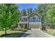 Charming two-story home with a well-manicured lawn, attached garage, and inviting curb appeal at 15035 Ockeechobee Ct, Mint Hill, NC 28227