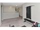 Spacious carpeted flex room, used as a home gym, with mounted workout equipment and ample natural light at 15035 Ockeechobee Ct, Mint Hill, NC 28227