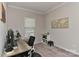 Bright home office with a neutral palette, window view, desk and ample shelving at 15035 Ockeechobee Ct, Mint Hill, NC 28227