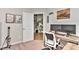 Functional home office with a large desk, dual monitors, and view into the front foyer at 15035 Ockeechobee Ct, Mint Hill, NC 28227