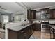 Granite countertops in a dark cabinet kitchen provide a functional and stylish cooking space at 15035 Ockeechobee Ct, Mint Hill, NC 28227