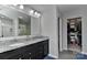 Spacious main bathroom with double sinks, granite countertop, and access to a walk-in closet at 15035 Ockeechobee Ct, Mint Hill, NC 28227