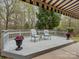 Outdoor back deck with outdoor seating, potted plants, and decorative railings at 1669 Beleek Ridge Ln, Clover, SC 29710