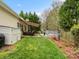 Exterior backyard with gray back deck, lawn, shed, and awning at 1669 Beleek Ridge Ln, Clover, SC 29710