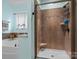 Bright bathroom featuring a glass-door shower and soaking tub near a window at 1669 Beleek Ridge Ln, Clover, SC 29710