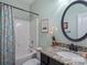 Well-lit bathroom showcasing vanity with granite counters and tub shower at 1669 Beleek Ridge Ln, Clover, SC 29710