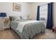Comfortable bedroom featuring a queen bed, soft lighting, and calming decor at 1669 Beleek Ridge Ln, Clover, SC 29710