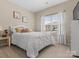 Cozy bedroom with a plush white bed and window views at 1669 Beleek Ridge Ln, Clover, SC 29710