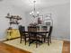 Bright dining room with chandelier, wall decor and adjacent buffet table at 1669 Beleek Ridge Ln, Clover, SC 29710