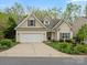 Inviting home exterior with well-maintained landscaping and a two-car garage at 1669 Beleek Ridge Ln, Clover, SC 29710