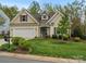 Charming single-Gathering home showcasing a manicured lawn and a classic architectural design at 1669 Beleek Ridge Ln, Clover, SC 29710