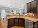 Well-lit kitchen with granite countertops and stainless steel appliances at 1669 Beleek Ridge Ln, Clover, SC 29710