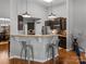 Modern kitchen with stainless steel appliances, bar seating, and pendant lighting at 1669 Beleek Ridge Ln, Clover, SC 29710