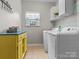 Bright laundry room featuring a window and modern appliances at 1669 Beleek Ridge Ln, Clover, SC 29710