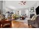 Bright living room with hardwood floors, fireplace, and comfortable seating at 1669 Beleek Ridge Ln, Clover, SC 29710