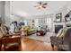 Bright living room with hardwood floors, fireplace, and comfortable seating at 1669 Beleek Ridge Ln, Clover, SC 29710