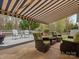 Inviting outdoor patio with comfortable seating and retractable awning at 1669 Beleek Ridge Ln, Clover, SC 29710