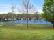 Community blue tennis courts surrounded by trees at 1669 Beleek Ridge Ln, Clover, SC 29710