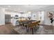 Bright dining area featuring modern furniture, a stylish rug, and an abundance of natural light at 18013 Aura Mist Way # 183, Huntersville, NC 28078