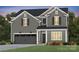 Charming two-story home featuring a gray exterior, black shutters, and well-manicured landscaping at 18013 Aura Mist Way # 183, Huntersville, NC 28078