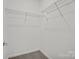 Walk-in closet with wire shelving, carpeted floor and neutral paint at 18013 Aura Mist Way # 183, Huntersville, NC 28078