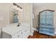 Well-lit bathroom featuring a large mirror, plenty of counter space, and a vintage cabinet at 206 23Rd Nw St, Hickory, NC 28601