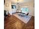 Well-lit dining room featuring hardwood floors, a modern light fixture, and stylish decor at 206 23Rd Nw St, Hickory, NC 28601