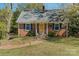 Lovely brick home with a welcoming yellow front door and neatly manicured lawn at 206 23Rd Nw St, Hickory, NC 28601