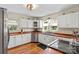 Bright kitchen features white cabinets, wood countertops, stainless steel appliances, and hardwood floors at 206 23Rd Nw St, Hickory, NC 28601