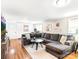 Spacious living room with a large sectional sofa, hardwood floors, and a mountain view TV at 206 23Rd Nw St, Hickory, NC 28601