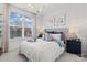 Beautiful bedroom with a large window for natural light, white walls, and elegant decor and furnishings at 2212 Indigo Branch Rd, Indian Land, SC 29707