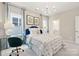 This bedroom boasts a comfortable bed, stylish lighting, and large windows for abundant natural light at 2212 Indigo Branch Rd, Indian Land, SC 29707