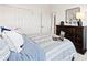 This cozy bedroom features a striped comforter, dresser and closet doors for ample storage space at 2212 Indigo Branch Rd, Indian Land, SC 29707