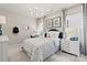 This bedroom boasts a comfortable bed, stylish lighting, and large windows for abundant natural light at 2212 Indigo Branch Rd, Indian Land, SC 29707