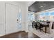 View of the dining room area with stylish decor, lighting and a front door view at 2212 Indigo Branch Rd, Indian Land, SC 29707