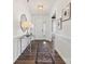 Entry hallway featuring wood flooring, mirror and a view of the dining room at 2212 Indigo Branch Rd, Indian Land, SC 29707