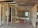 Interior view of new construction home featuring a staircase and open floor plan with wooden framing at 2212 Indigo Branch Rd, Indian Land, SC 29707
