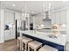 Modern kitchen featuring stainless appliances, white cabinets, large center island with seating and modern pendant lights at 2212 Indigo Branch Rd, Indian Land, SC 29707