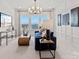 Living room with a modern sofa, stylish decor, a large window, and plenty of space for entertaining at 2212 Indigo Branch Rd, Indian Land, SC 29707