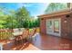 Outdoor deck with a dining table, seating for six and an entrance to the house at 2610 Mchanna Pt, Fort Mill, SC 29708