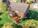 Expansive brick home with a wooden deck, lush landscaping, and a well-maintained lawn at 2610 Mchanna Pt, Fort Mill, SC 29708