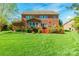 Brick home featuring a deck, windows, and a beautiful yard, offering an ideal outdoor living space at 2610 Mchanna Pt, Fort Mill, SC 29708
