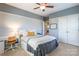 Bedroom with gray and white walls, carpeted floor, ceiling fan, desk and a closet at 2610 Mchanna Pt, Fort Mill, SC 29708