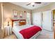 Bedroom with a wood-framed bed, two windows with blinds and curtains, carpeted floor and ceiling fan at 2610 Mchanna Pt, Fort Mill, SC 29708