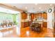 Gourmet kitchen with a center island, granite countertops, and stainless steel appliances, open to dining area at 2610 Mchanna Pt, Fort Mill, SC 29708